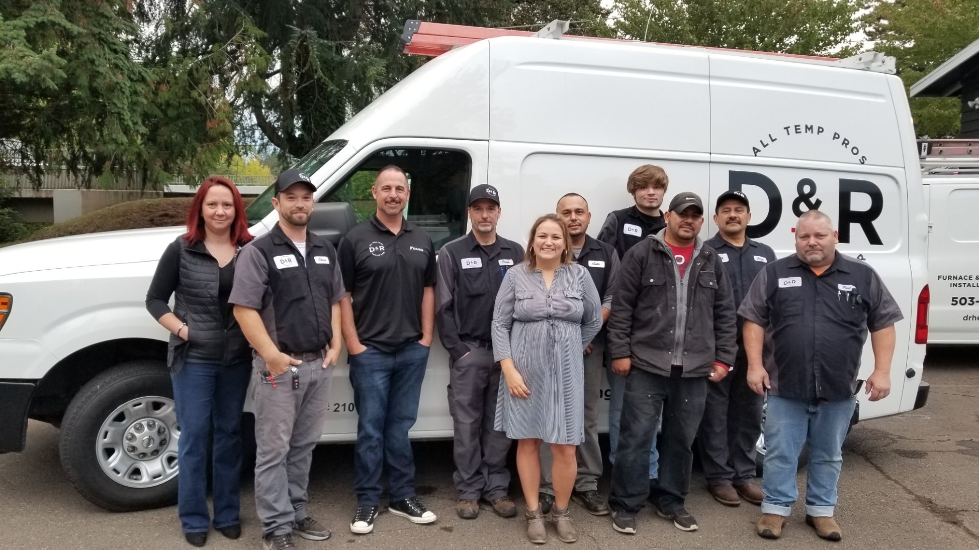 Team Photo D and R team standing in front of work van